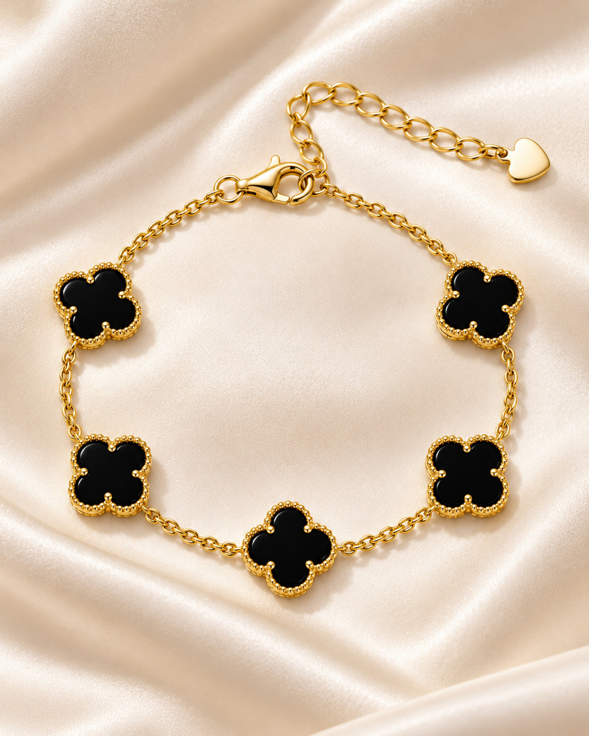 Gold-tone five-clover bracelet with black onyx centres