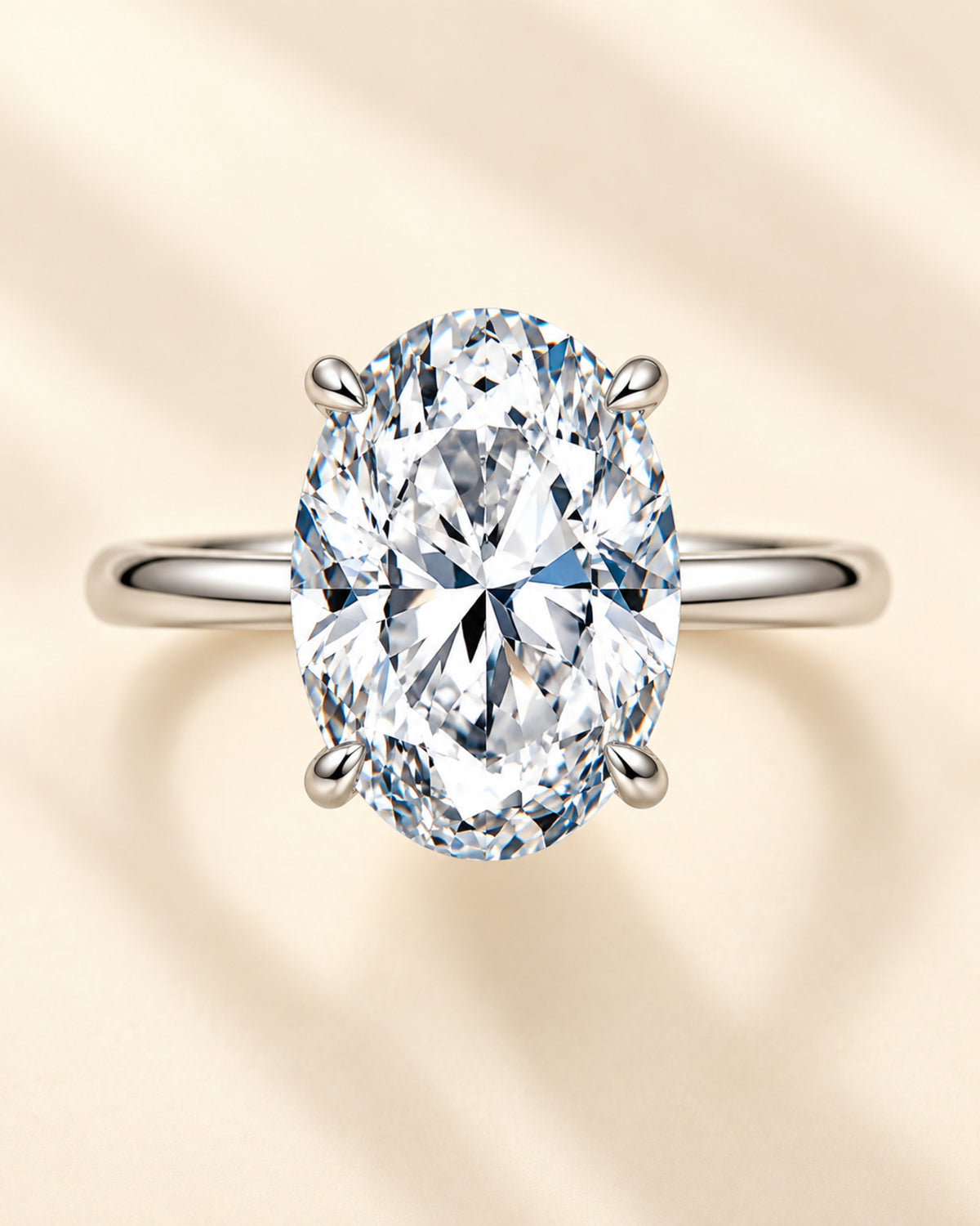 Oval moissanite four-prong solitaire ring top view