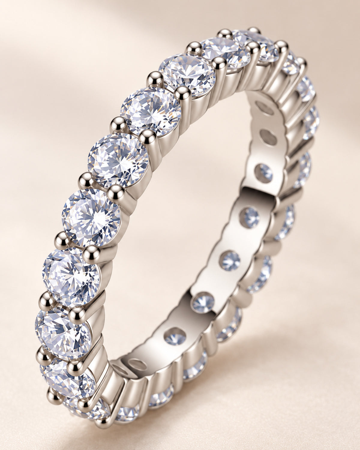 Macro view of round moissanite shared-prong eternity ring