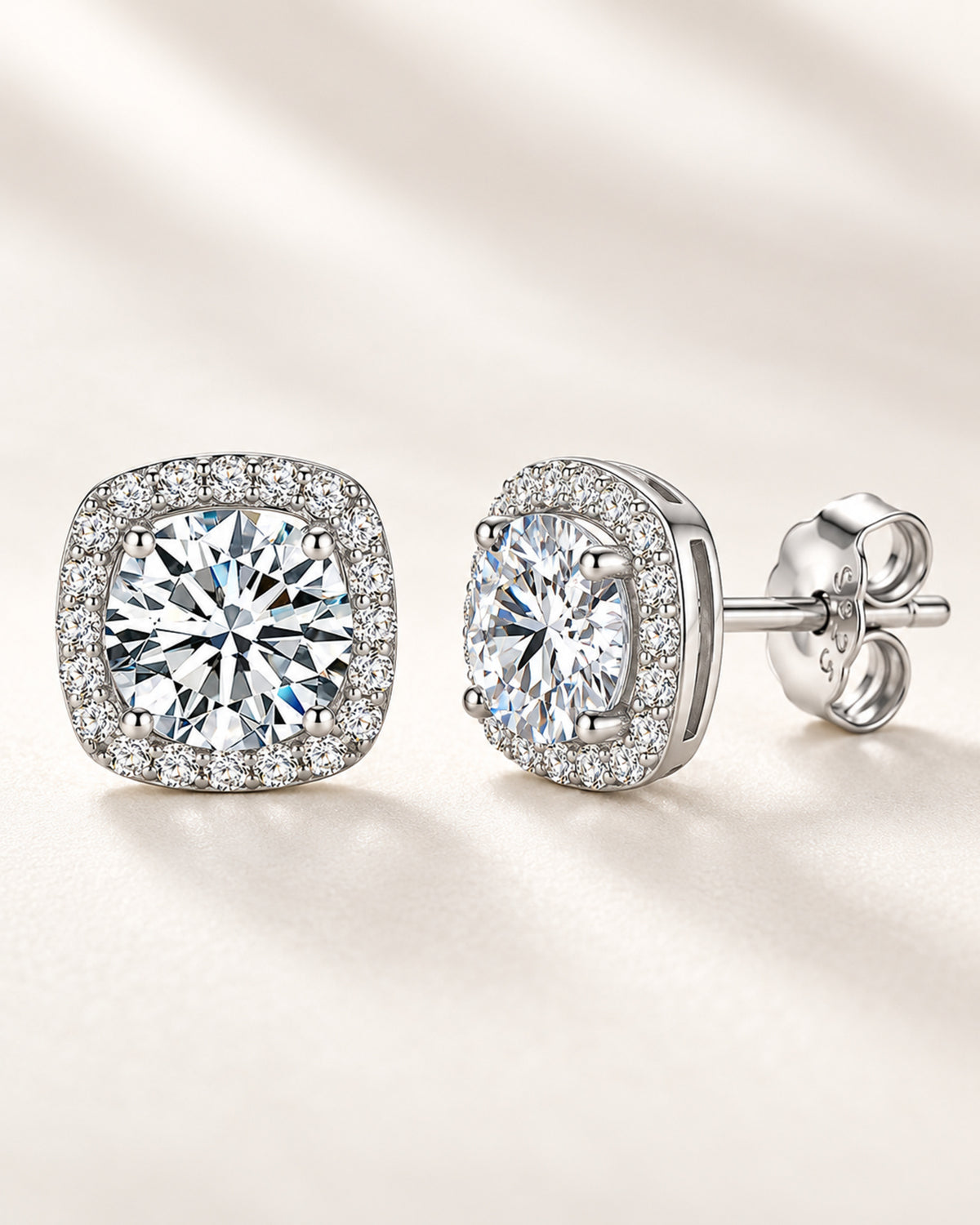 Silver moissanite cushion halo stud earrings showing front and profile