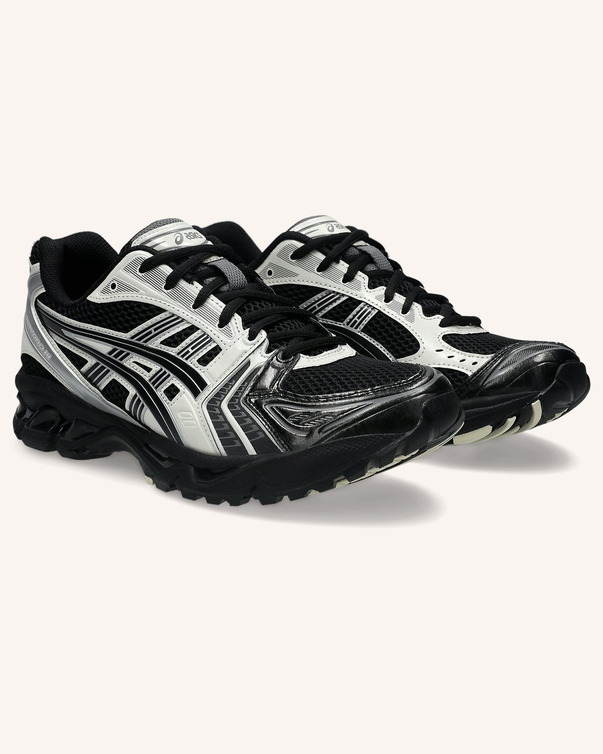 ASICS GEL-KAYANO 14 in Black/Cream, pair front view