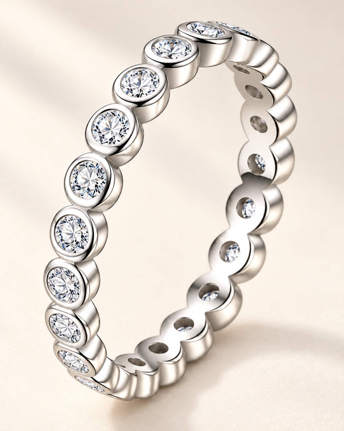 Macro view of round moissanite bezel-set eternity ring