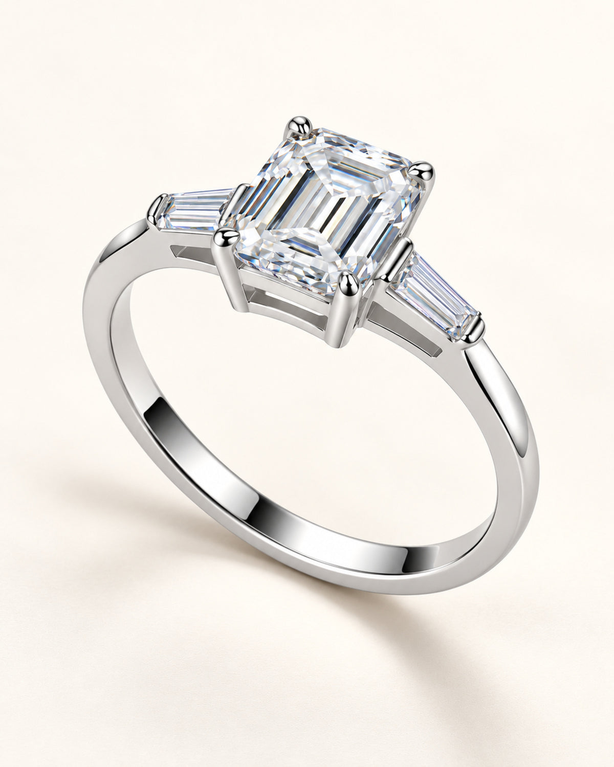 Side view of three-stone moissanite ring and prong setting