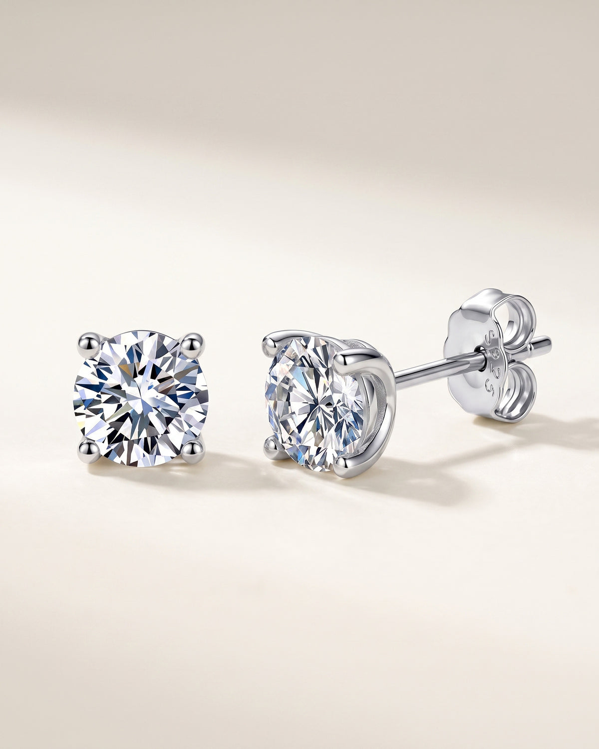 Silver-tone four-prong round moissanite stud earrings in S925 sterling silver