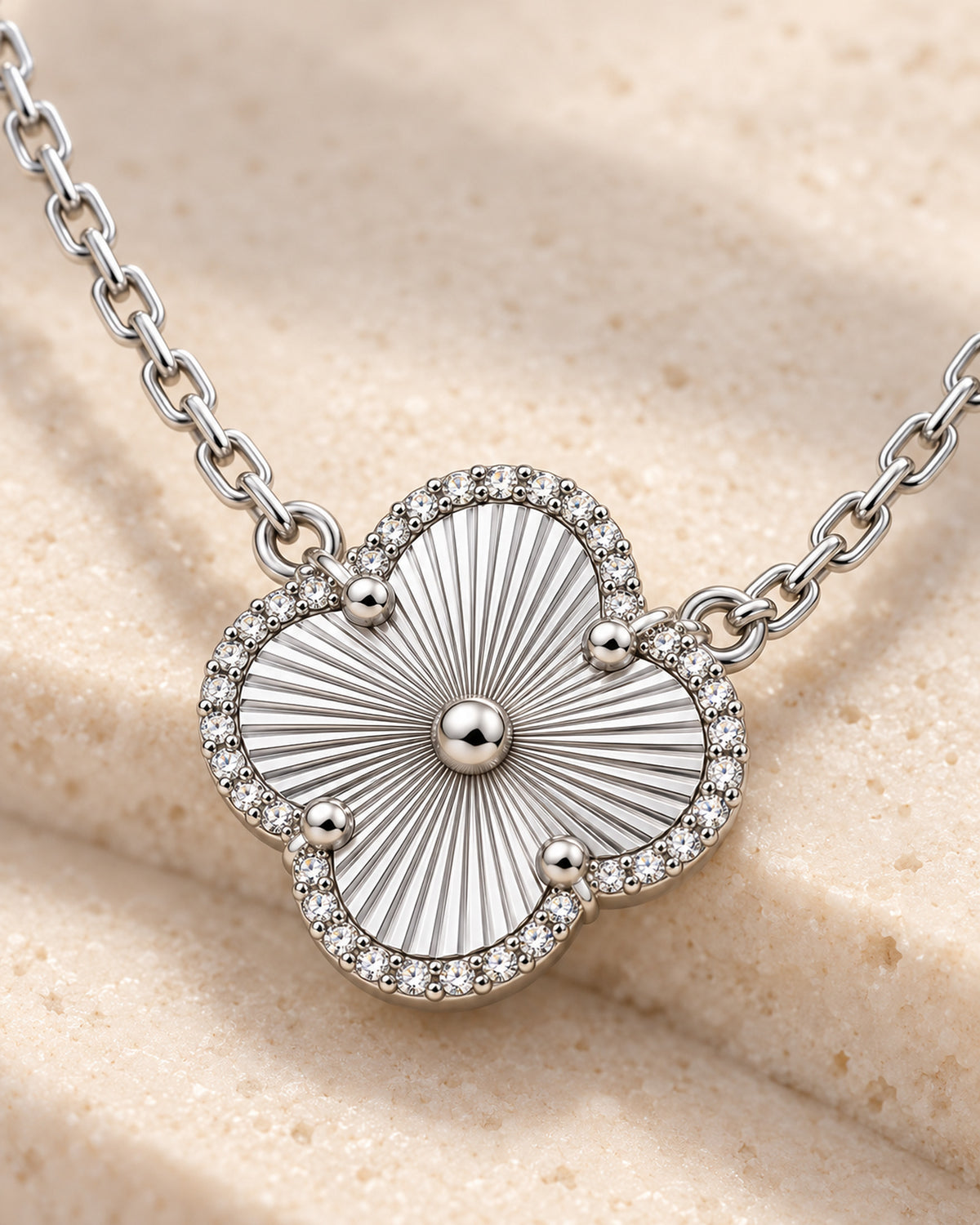 S925 sterling silver four-leaf clover pendant with sunburst engraving and moissanite rim